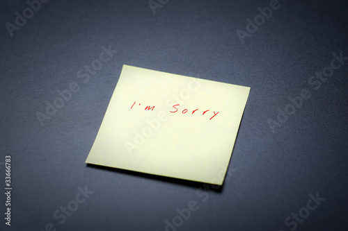 Photo: yellow postit with I'm sorry tect on a black board yellow postit with I'm sorry tect on a black board