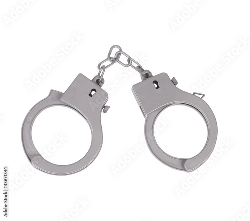 Photo: Metal handcuffs for hands on a white background Metal handcuffs for hands on a white background