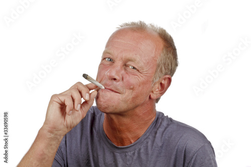 Photo: Man enjoying smoking s marijuana joint Man enjoying smoking s marijuana joint