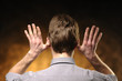Man with hands on ears