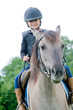 Horse riding - little girl is riding a horse