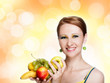 Young caucasian woman holding fruit
