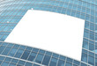 blue glass wall with blank placard of skyscraper