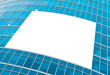 blue glass wall with blank placard of skyscraper