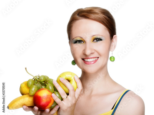 Photo: Young caucasian woman holding fruit Young caucasian woman holding fruit
