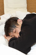 Man comfortably sleeping in his bed