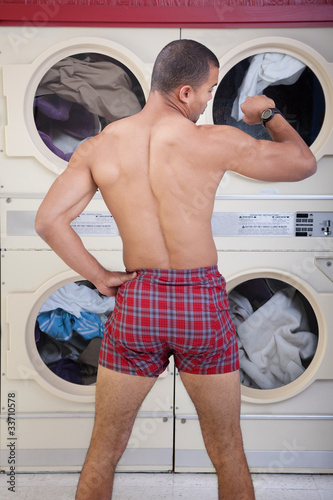 Photo: Partially Dressed In the Laundromat Partially Dressed In the Laundromat
