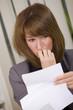 shocked business woman reading letter