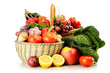 Raw vegetables and wicker baskets isolated on white Raw vegetables and wicker baskets isolated on white