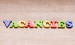 Employment concept with letters on background