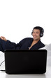 Nepalese man in pajamas, laptop