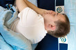 Man comfortably sleeping in his bed