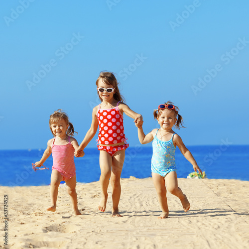 Photo: Kids playing at the beach Kids playing at the beach