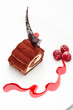 Chocolate roll with crud and mango cream isolated