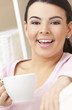 Beautiful Hispanic Latina Woman Drinking Tea or Coffee