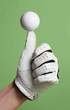 golf ball over thumb