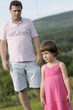 sad child having dispute with father