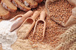Wood spoons with whole wheat grains, wheat bran and flour Wood spoons with whole wheat grains, wheat bran and flour