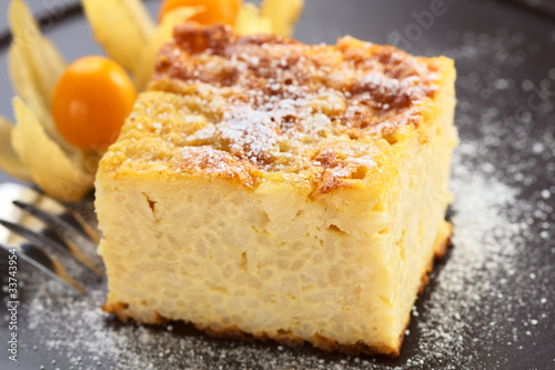 Photo: Baked rice pudding dessert sweetened with sugar powder Baked rice pudding dessert sweetened with sugar powder
