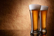 Beer into glass on a old stone