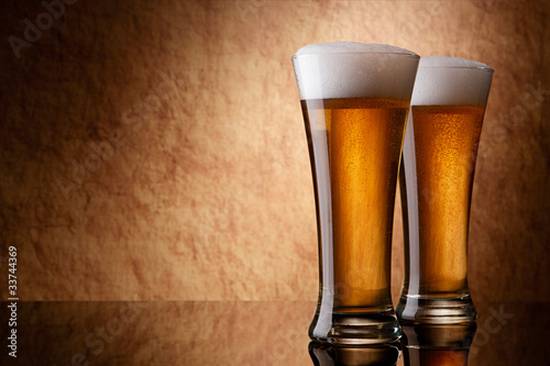 Photo : Beer into glass on a old stone Beer into glass on a old stone