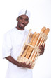 Baker with a basket of baguettes