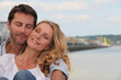 Couple in a loving embrace on the waterfront of Bordeaux