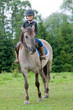 Horse riding - little girl is riding a horse