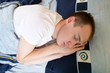 Man comfortably sleeping in his bed