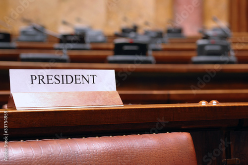 Photo: empty president seat in conference hall empty president seat in conference hall