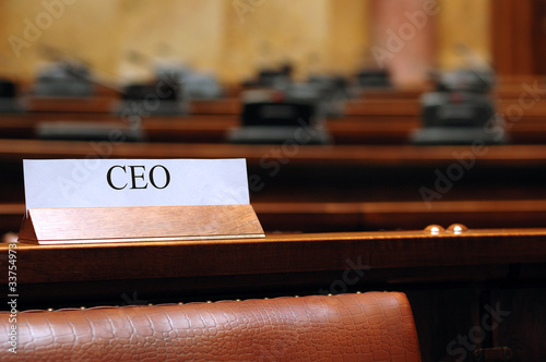 Photo: empty CEO seat in conference hall empty CEO seat in conference hall