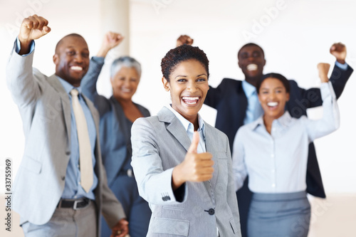 Photo: Victorious business team Victorious business team
