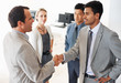 Business team greeting in office