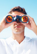 Handsome man looking through binoculars Handsome man looking through binoculars