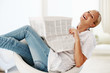 Relaxed woman reading newspaper