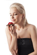 pretty girl smelling a sweet