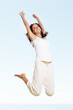 Foto: Woman jumping in air Woman jumping in air