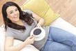 Beautiful Hispanic Latina Woman Drinking Tea or Coffee