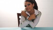 Close up of pretty multi ethnic woman sitting and smiling