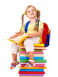 Child sitting on pile of books. Child sitting on pile of books.