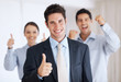 Successful business man with supporting team