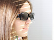Photo: Young brunette woman in the sunlight looking Young brunette woman in the sunlight looking