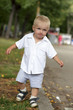 Boy walks in park