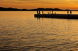 People standing on a jetty at sunset in Zadar