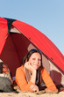Camping happy woman relax tent on beach