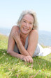 Portrait of cheerful senior woman in natural landscape Portrait of cheerful senior woman in natural landscape
