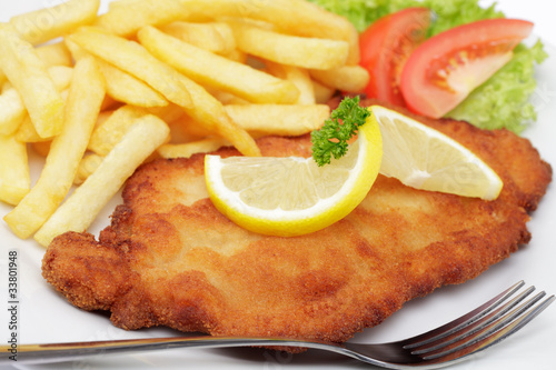 Foto: Schweineschnitzel Wiener Art mit Pommes frites Schweineschnitzel Wiener Art mit Pommes frites