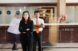 Photo: Hotel reception with motion blurred bellboy at the background. Hotel reception with motion blurred bellboy at the background.