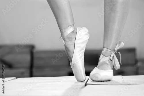 Photo: Closeup view of female feet in pointes Closeup view of female feet in pointes