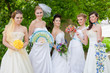 Group of five cute brides outdoors